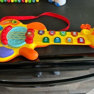 Collectible VTech toy guitar in new condition